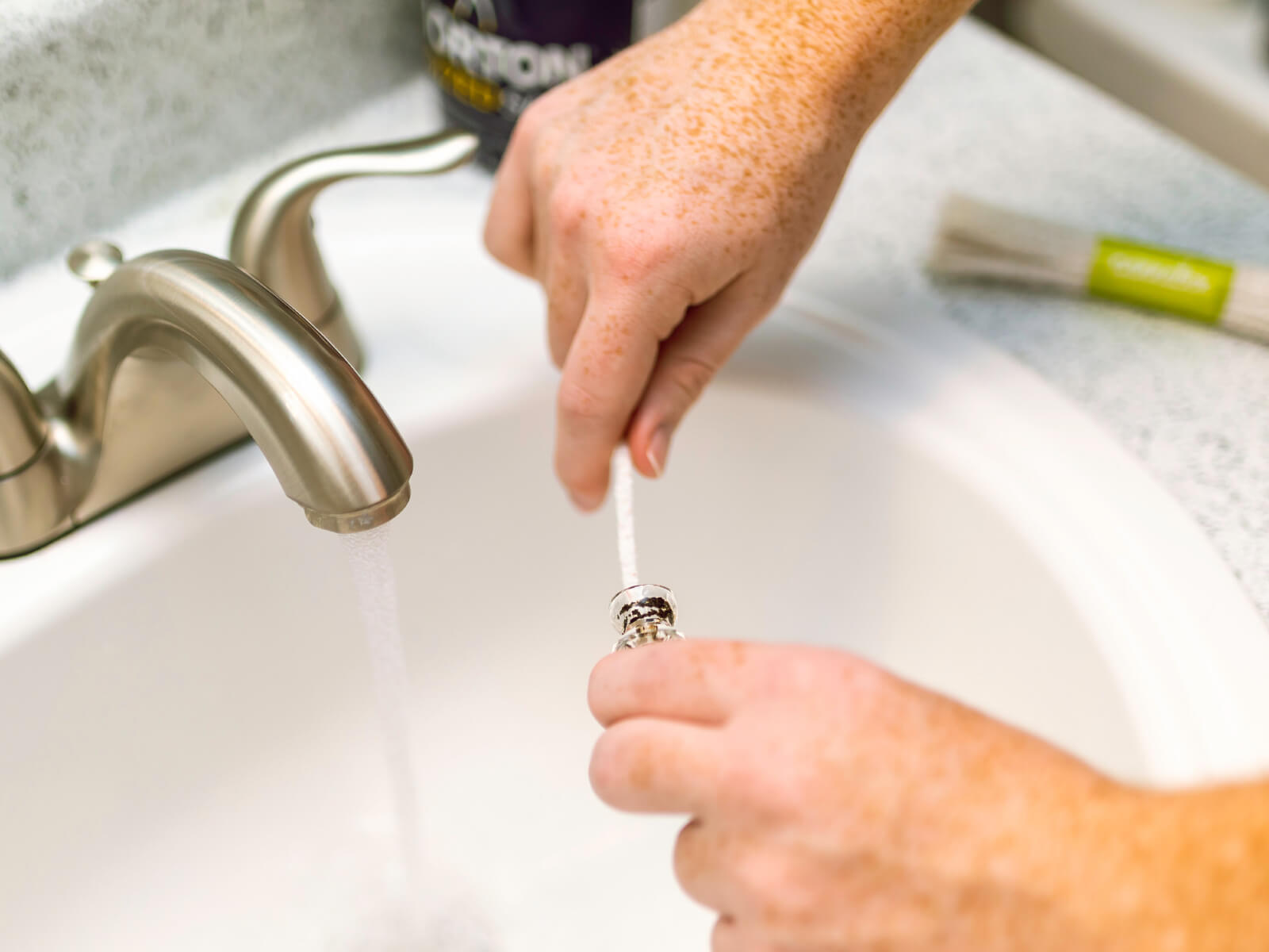 Cleaning a glass piece over the sink